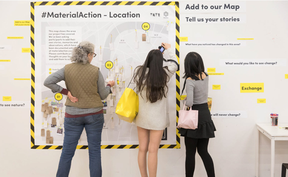 Three woman looking at a map 